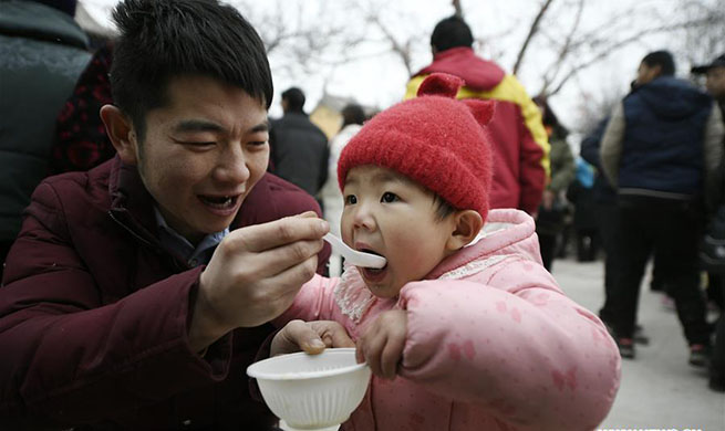 Folk event held to celebrate Laba Festival in N China