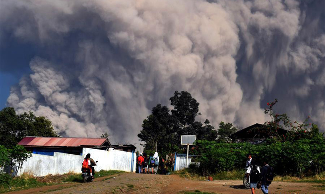 Indonesia volcano erupts, producing columns of ash